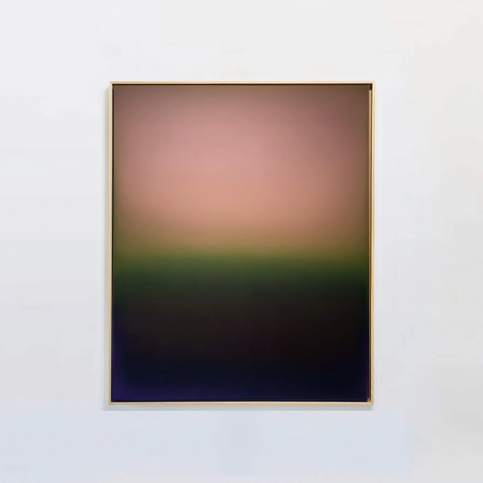 A framed painting where a warm rose sky settles onto a band of green and then into near-black indigo below.