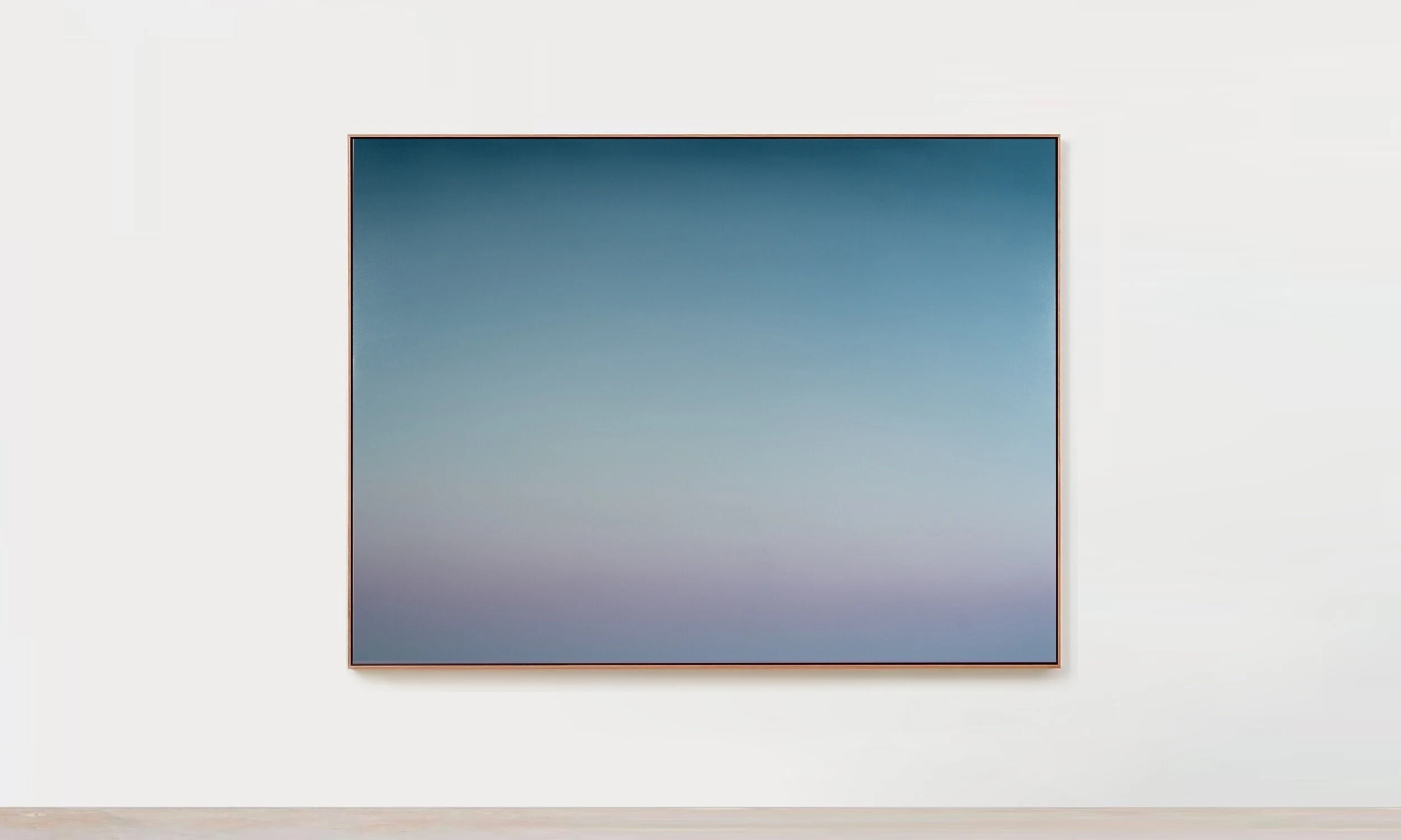 A wide painting of deep teal at the top fading down through grey-blue into a pale lilac band along the bottom.