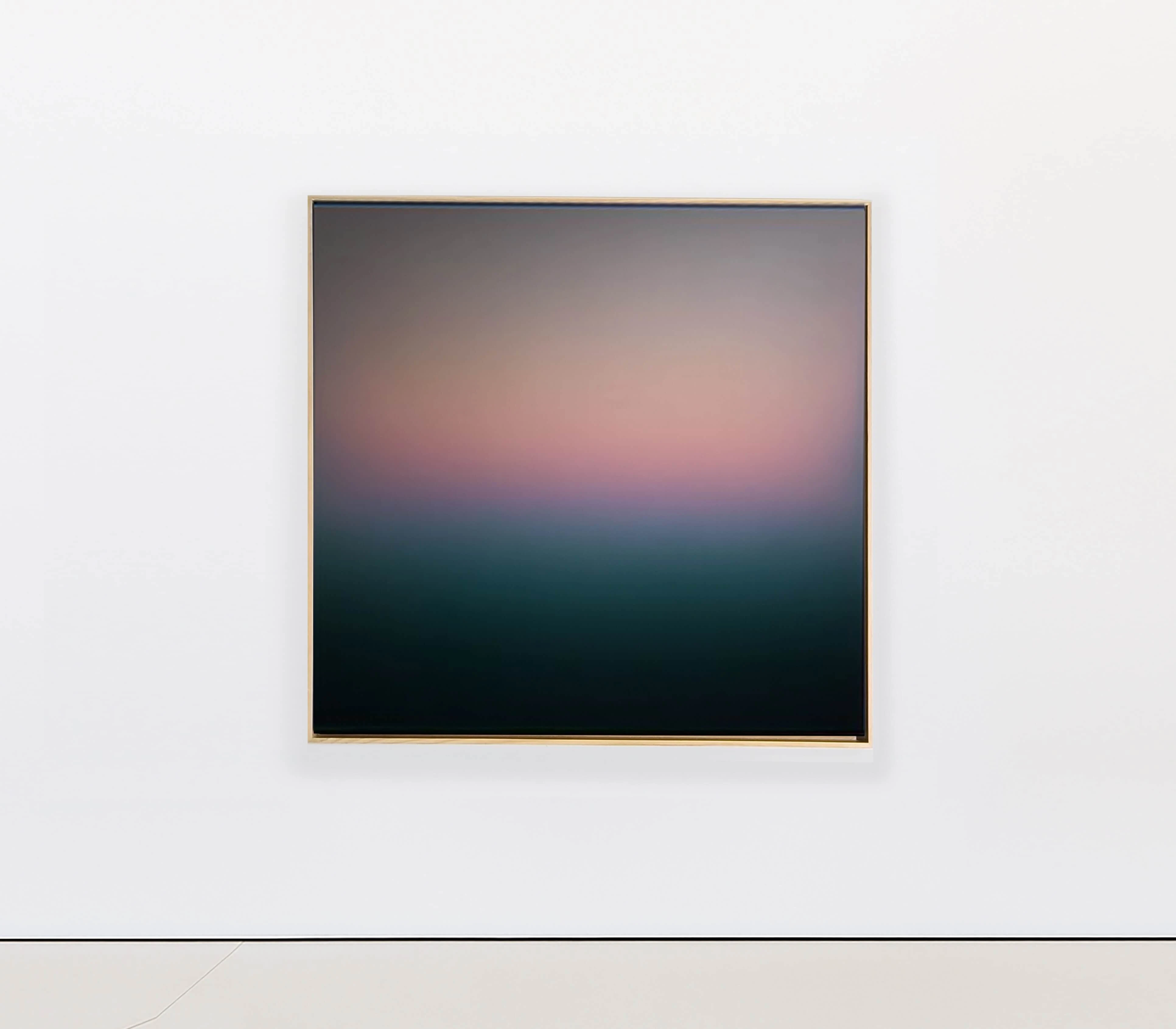 A square painting, grey above a blush pink horizon that settles onto a deep green-black field below.