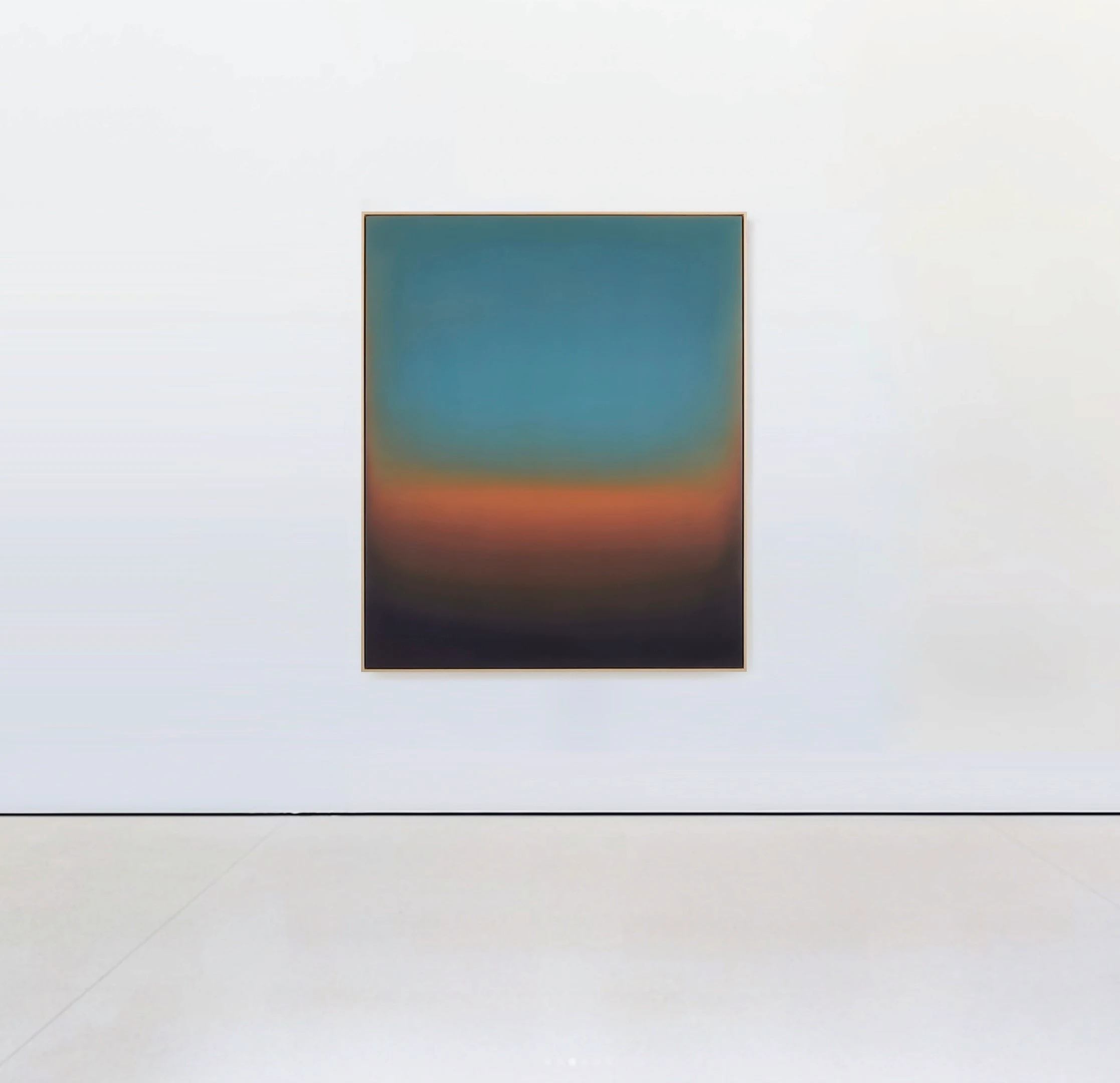 A framed painting with a clear teal sky above a burning orange band that darkens into black at the base.