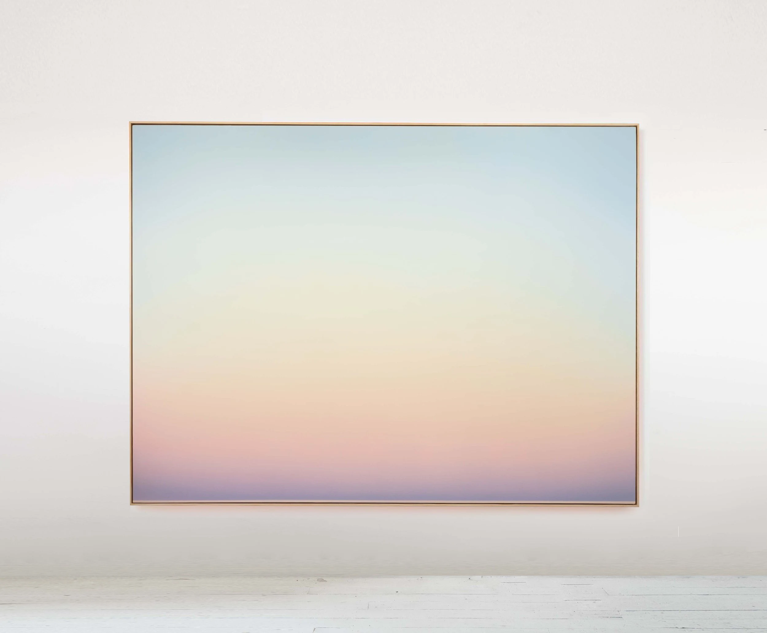 A wide pastel painting graded from pale blue through cream and peach into a soft lilac horizon.